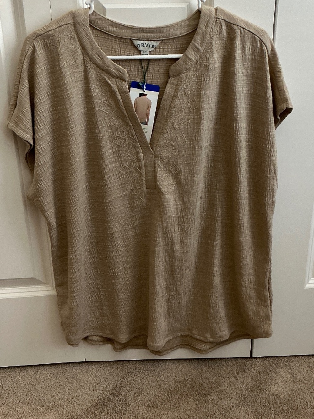 Or is tan v neck top large